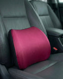 Red memory foam car backrest cushion on driver seat with breathable fabric cover