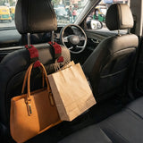 red rhinestone car headrest hooks holding shopping bags car organizer. An aesthetic Car-Wah! car storage solution to keep your car neat and happy.
