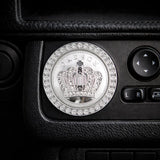 Silver crown style car ignition ring on dashboard – rhinestone start button cover. Adds a bold, fun 'wah' to your car interior with Car-Wah!