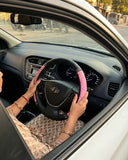 Pink PU leather anti-slip steering wheel cover installed on 38 cm steering wheel for better comfort and control. A premium Car-Wah! car accessory to show off your ride's personality.