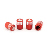 Red aluminum alloy tyre valve cap showing screw interior