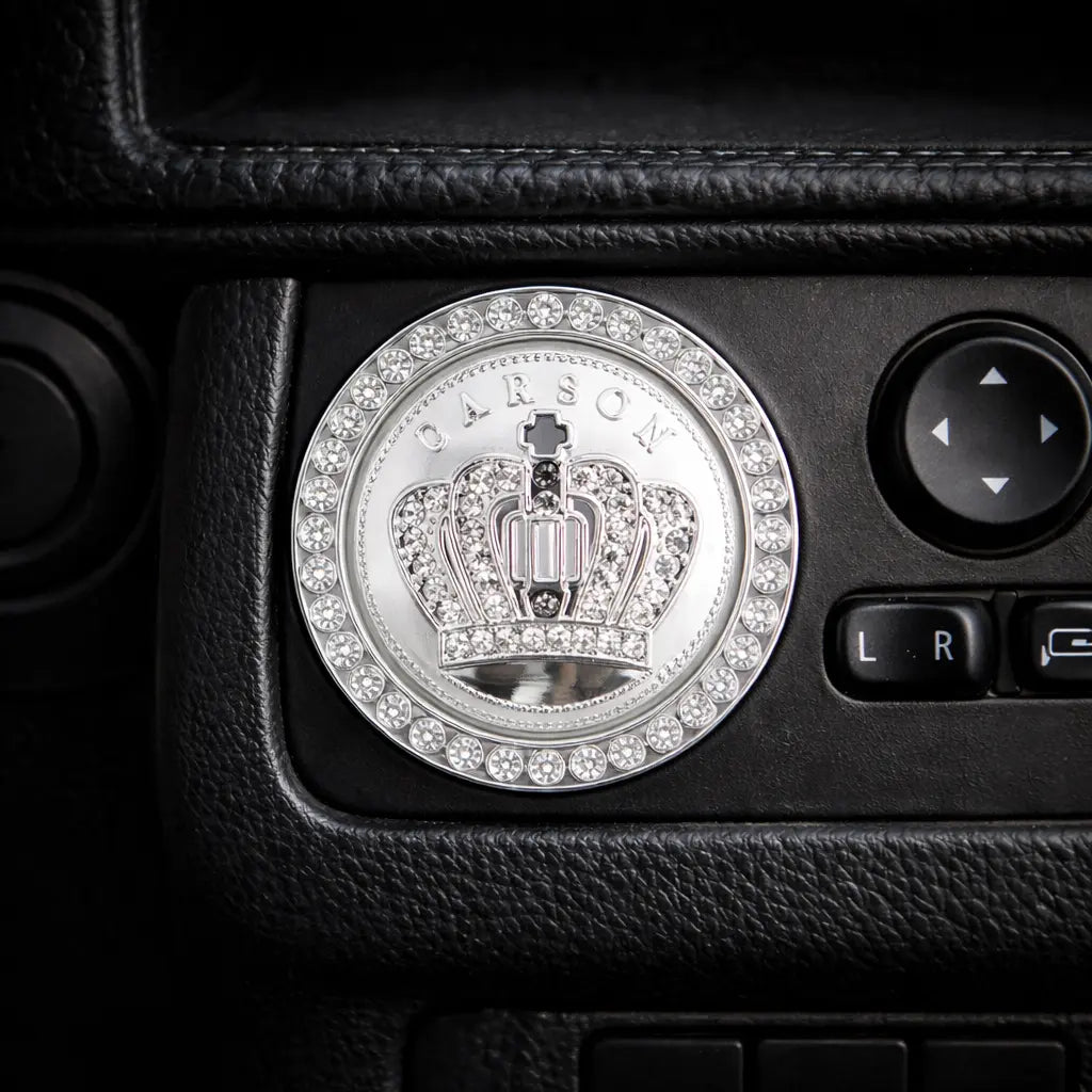 Silver crown style car ignition ring on dashboard – rhinestone start button cover. Adds a bold, fun 'wah' to your car interior with Car-Wah!