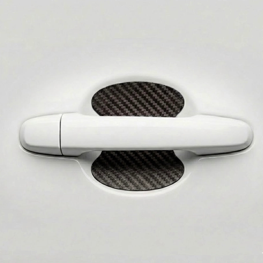 Black carbon fiber door bowl scratch protector sticker installed behind car door handle. A useful and aesthetic Car-Wah! car accessory upgrade for your daily drives.
