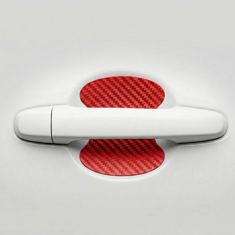 Red carbon fiber car door handle scratch protector sticker applied behind door handle on white car. A bold Car-Wah! car accessory statement piece that adds instant personality.