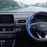 blue carbon fibre steering wheel cover inside modern car interior India. A premium Car-Wah! car accessory for an instant car interior upgrade.
