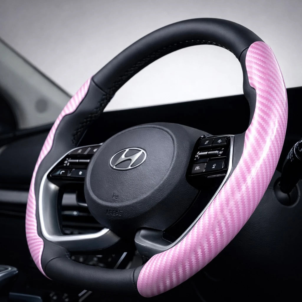 pink carbon fibre steering wheel cover close angle interior detail. A premium Car-Wah! car accessory for an instant car interior upgrade.