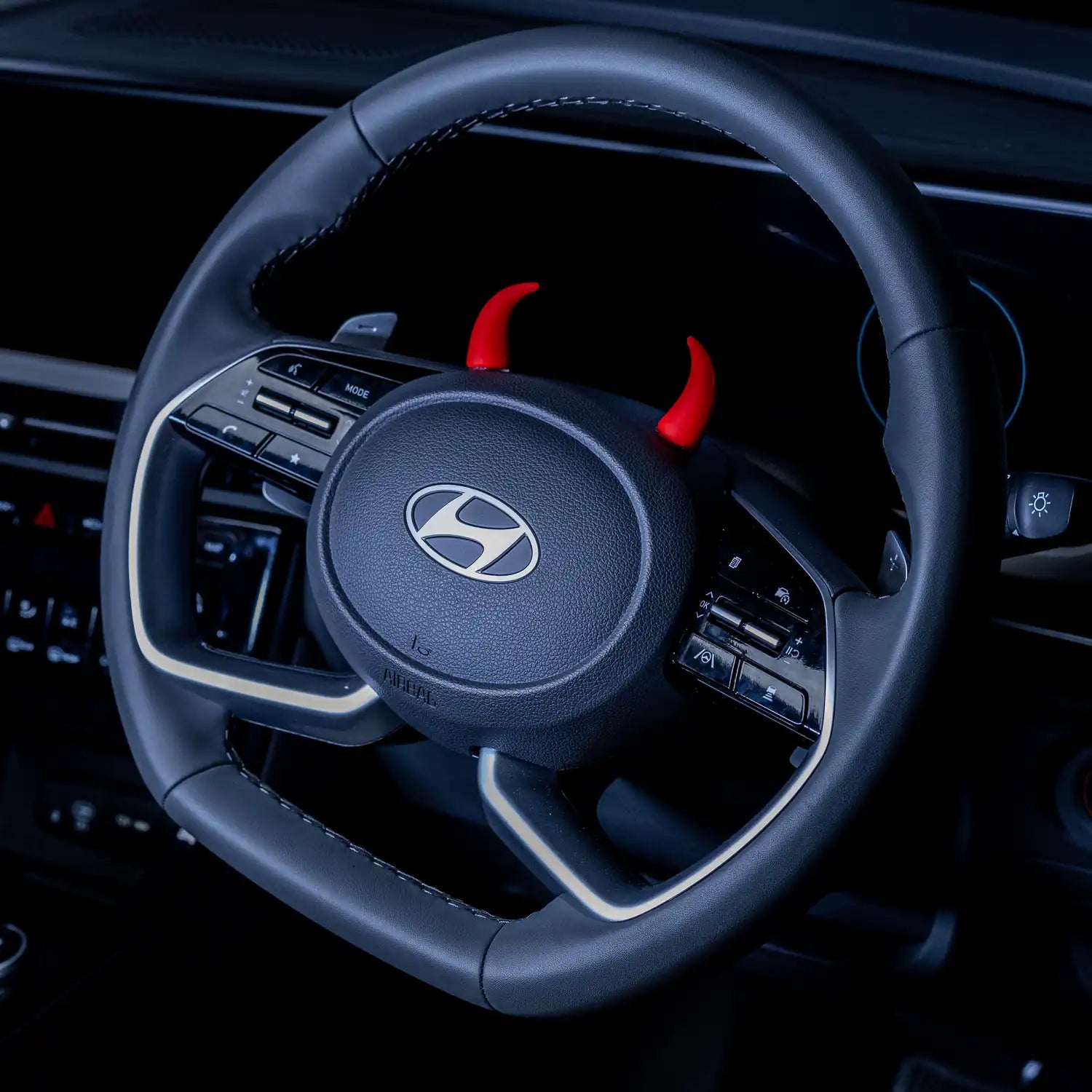 red devil horn steering wheel decor installed in car interior. Add a bold, unique car accessory to your car interior with Car-Wah!