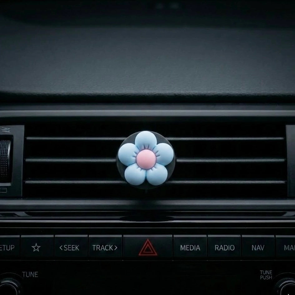 Blue flower car air freshener vent clip on car AC vent dashboard. A fun and fresh Car-Wah! car perfume for your daily commute.