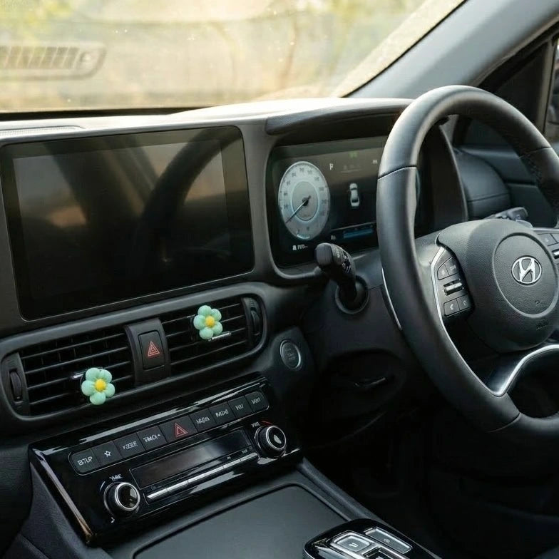 Floral car air freshener vent clips adding aesthetic decor to car dashboard. A unique Car-Wah! car fragrance to keep your car cabin smelling extraordinary.