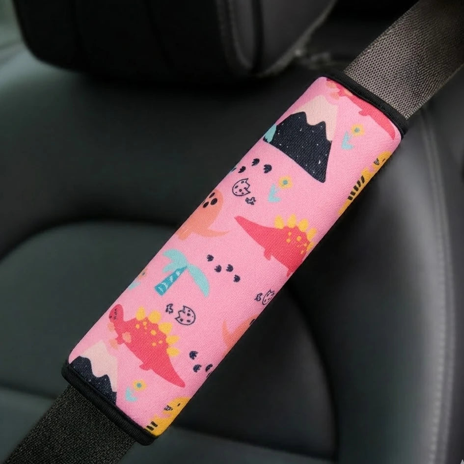 Pink kids seat belt cover installed on car seat – soft strap cushion for children. A unique and pratical Car-Wah! comfort car accessory for your ride.