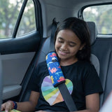 Child wearing blue seat belt cover – prevents seat belt rubbing on neck. Making traffic a little more fun with Car-Wah! comfort car accessories.