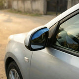 Blue rhinestone car side mirror cover installed on white sedan. A Car-Wah! unique and afforable car accessory.