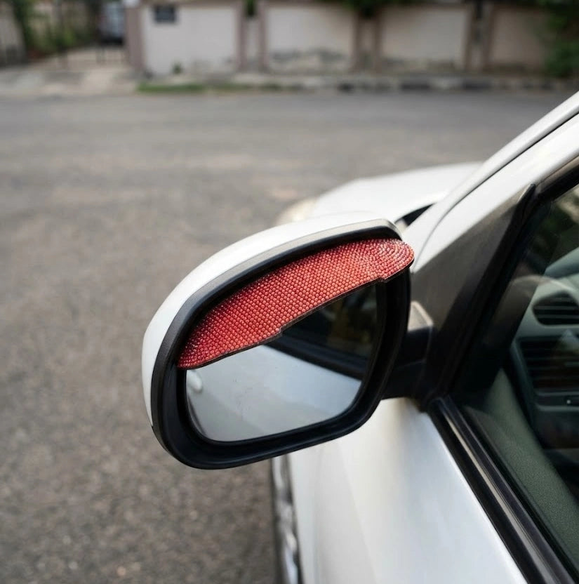 Red rhinestone side mirror cover installed on car exterior. A Car-Wah! unique and afforable car accessory.