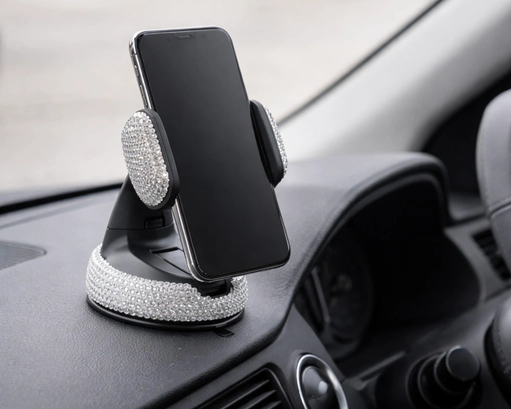Silver rhinestone car phone holder dashboard mount holding smartphone, adding a bling aesthetic to your car interior with Car-Wah!