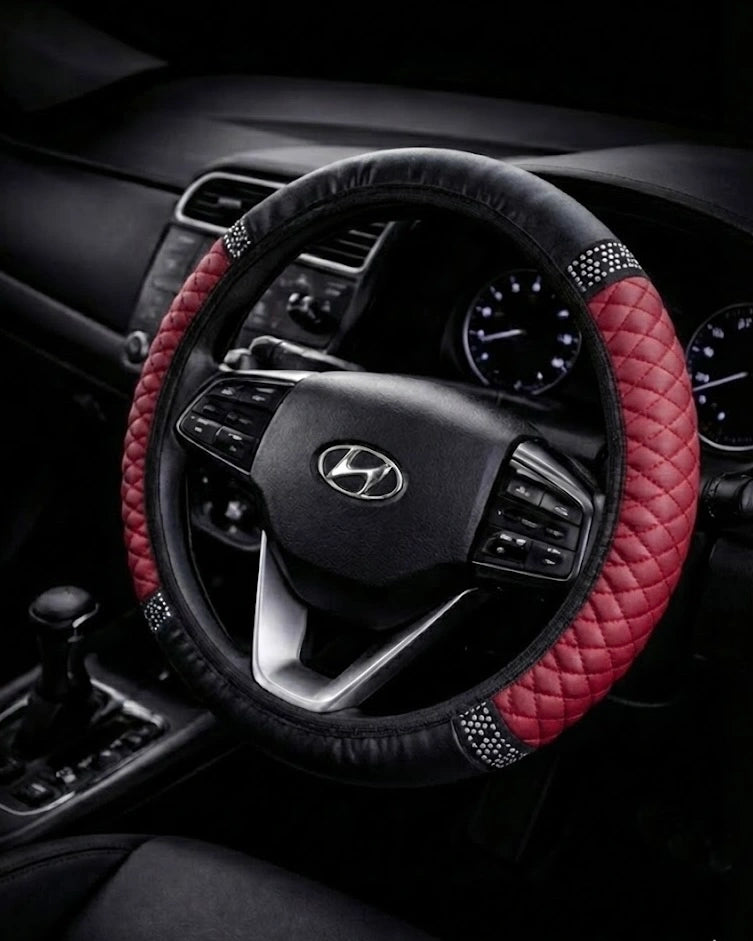 Maroon PU leather steering wheel cover with anti-slip rubber lining and rhinestone accents on 38 cm steering wheel.  A colourful Car-Wah! car decor upgrade for your daily drives.