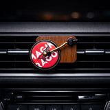 Record Player Car Air Freshener with funky vinyl perfume disc clipped to car AC vent. A unique Car-Wah! car perfume to keep your cabin smelling fresh. 