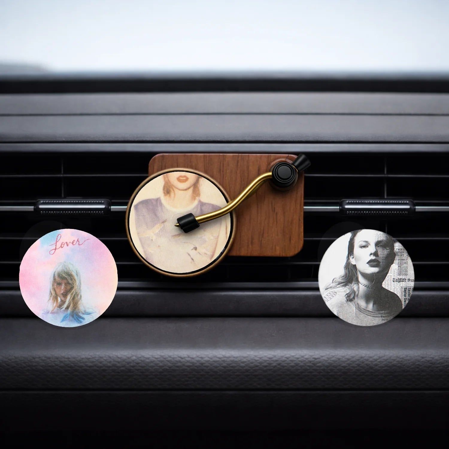 Record Player Car Air Freshener with 1989, Reputation and Lover perfume discs on car AC vent. A unique Car-Wah! car perfume to keep your cabin smelling fresh. 
