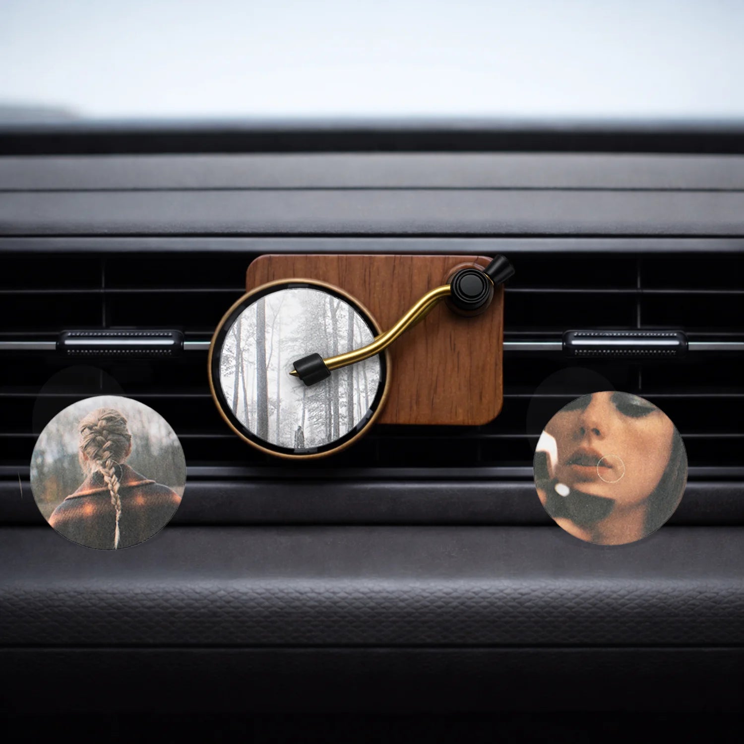 Record Player Car Air Freshener with Folklore, Evermore and Midnights fragrance discs on AC vent. A unique Car-Wah! car perfume to keep your cabin smelling fresh. 