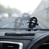 Sliding panda car dashboard decor installed on car dashboard – moving panda interior accessory while driving. A quirky Car-Wah! car accessory that adds instant personality to your car. 