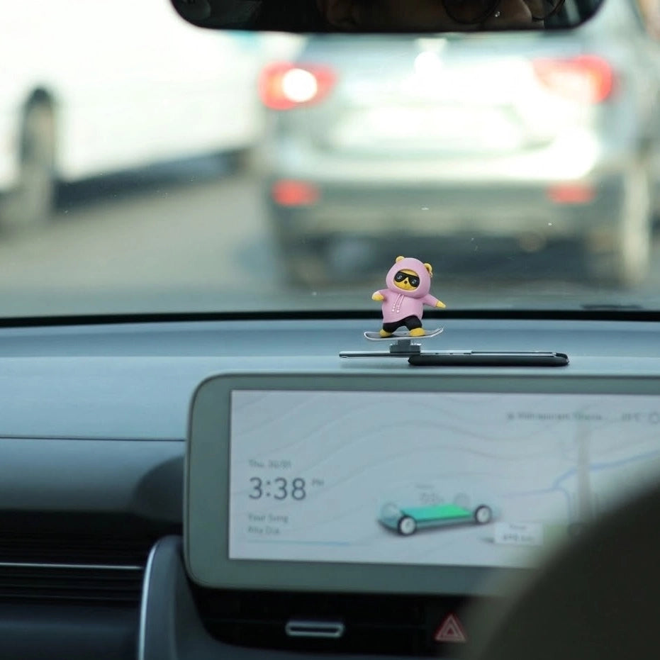 Pink sliding panda car dashboard decor on car dashboard during driving – cute moving panda dashboard accessory. A quirky Car-Wah! car accessory that adds instant personality to your car. 