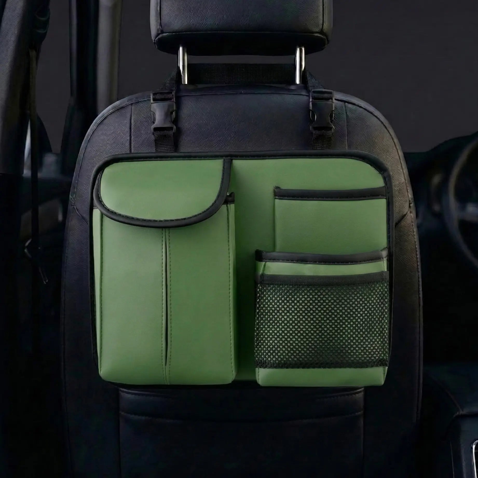 Green compact car seat back organizer installed behind front seat. A unique Car-Wah! car organizer for a stress-free drive.