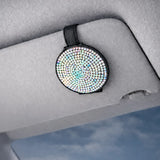 Polychrome magnetic sunglasses holder clipped to car visor. A practical and aesthetic car accessory by  Car-Wah! to keep your world on wheels organized.