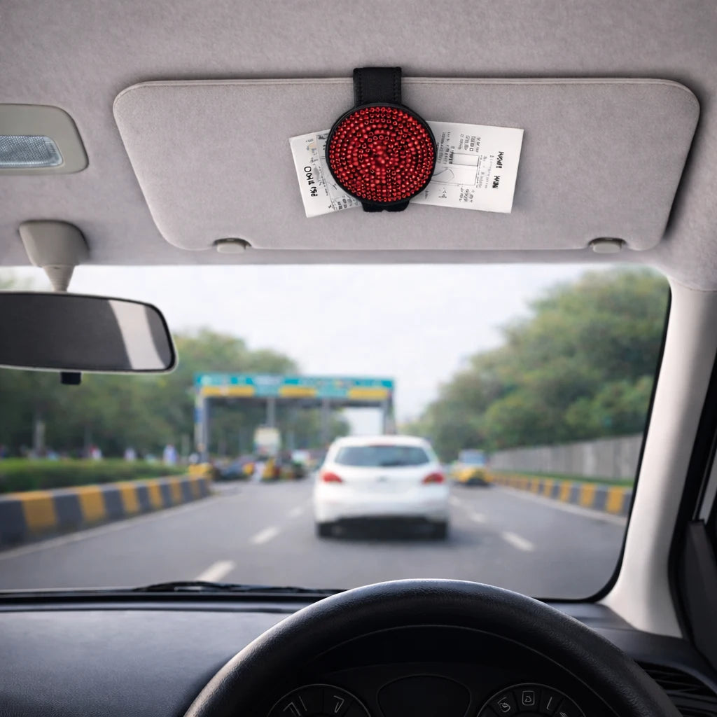 Red bling magnetic sunglasses holder clipped to car visor with parking receipts, A practical and aesthetic car accessory by  Car-Wah! to keep your world on wheels organized. 