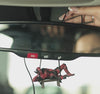 Anti-hero car dangler by Car-Wah! being set up in car