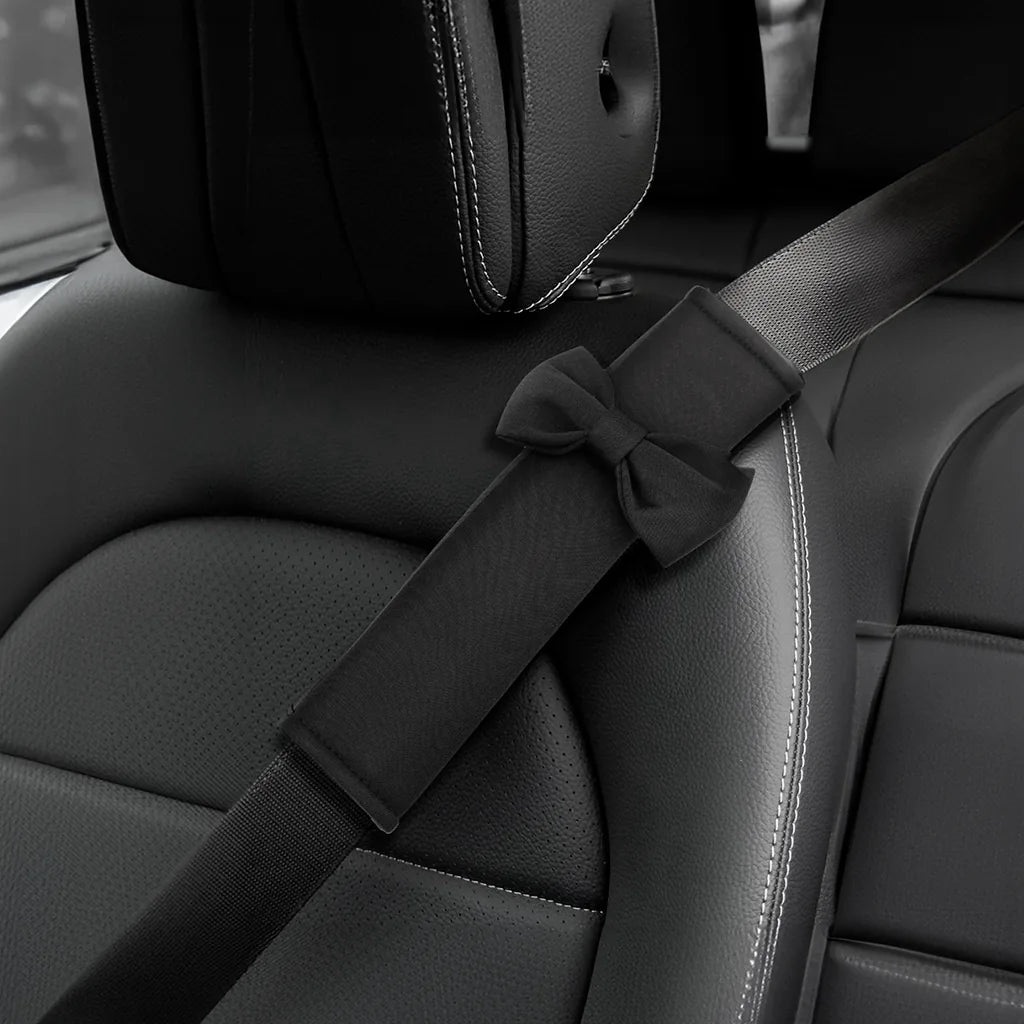 Black car seat belt cover installed on car seat. Making traffic a little more fun with Car-Wah! comfort car accessories.